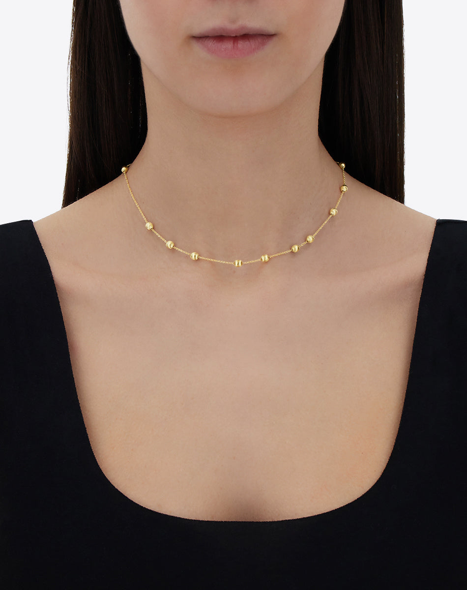 Collana girocollo "soffio" con boules in oro
