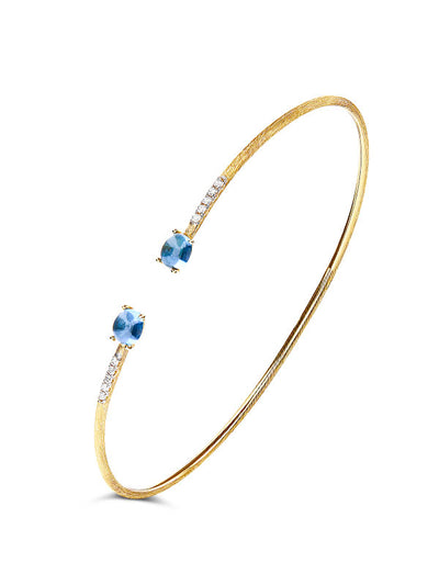 Bracciale a schiava "DANCING AZURE" inciso a mano in oro, diamanti e topazio London blu