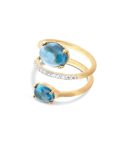 Anello contrariè "DANCING AZURE" in oro, diamanti e topazio London blu