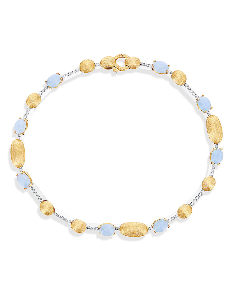 Bracciale tennis "DANCING AZURE" in oro, diamanti e acquamarina