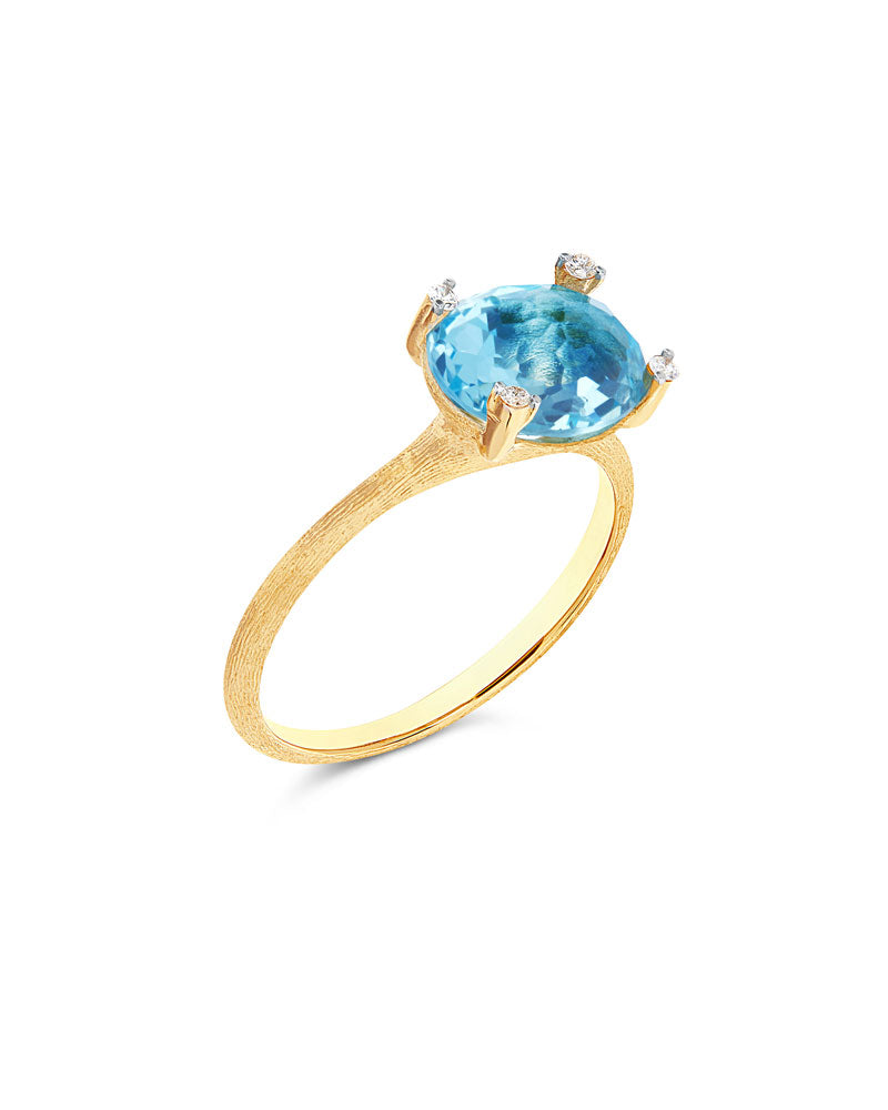 Anello "IPANEMA" in oro, topazio blu e dettagli di diamanti