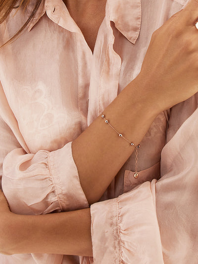 Bracciale "soffio" con boules in oro rosa