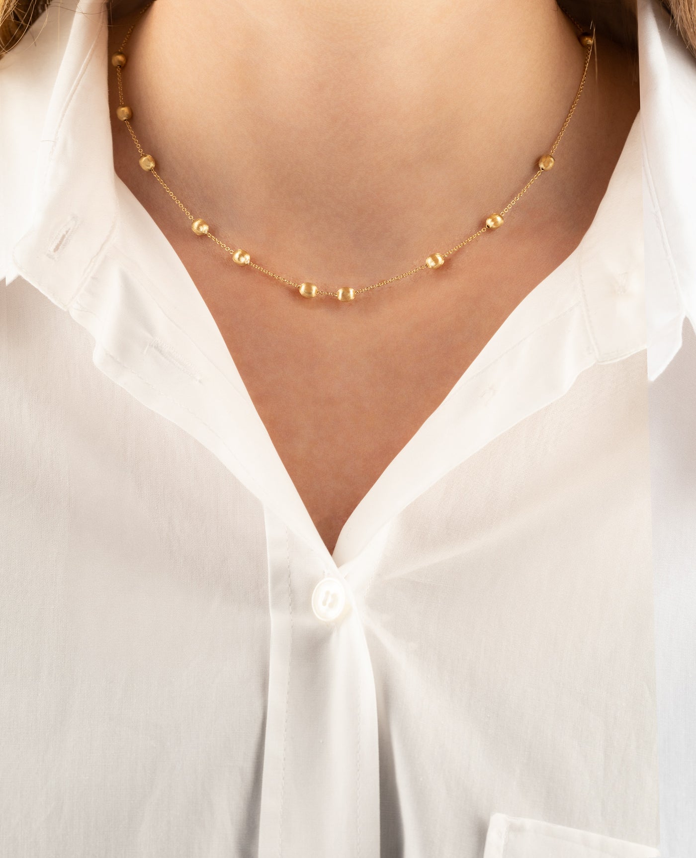 Collana girocollo "soffio" con boules in oro